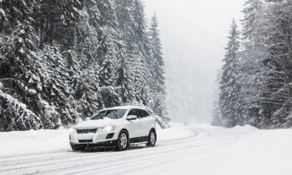 Modern Car On Snowy Road Near Forest Winter Vacation