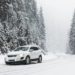 Modern Car On Snowy Road Near Forest Winter Vacation